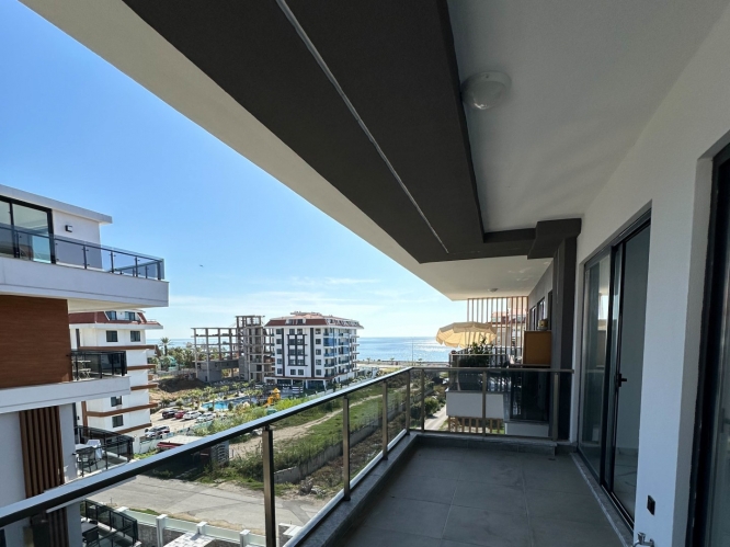 New building in Kestel with sea view